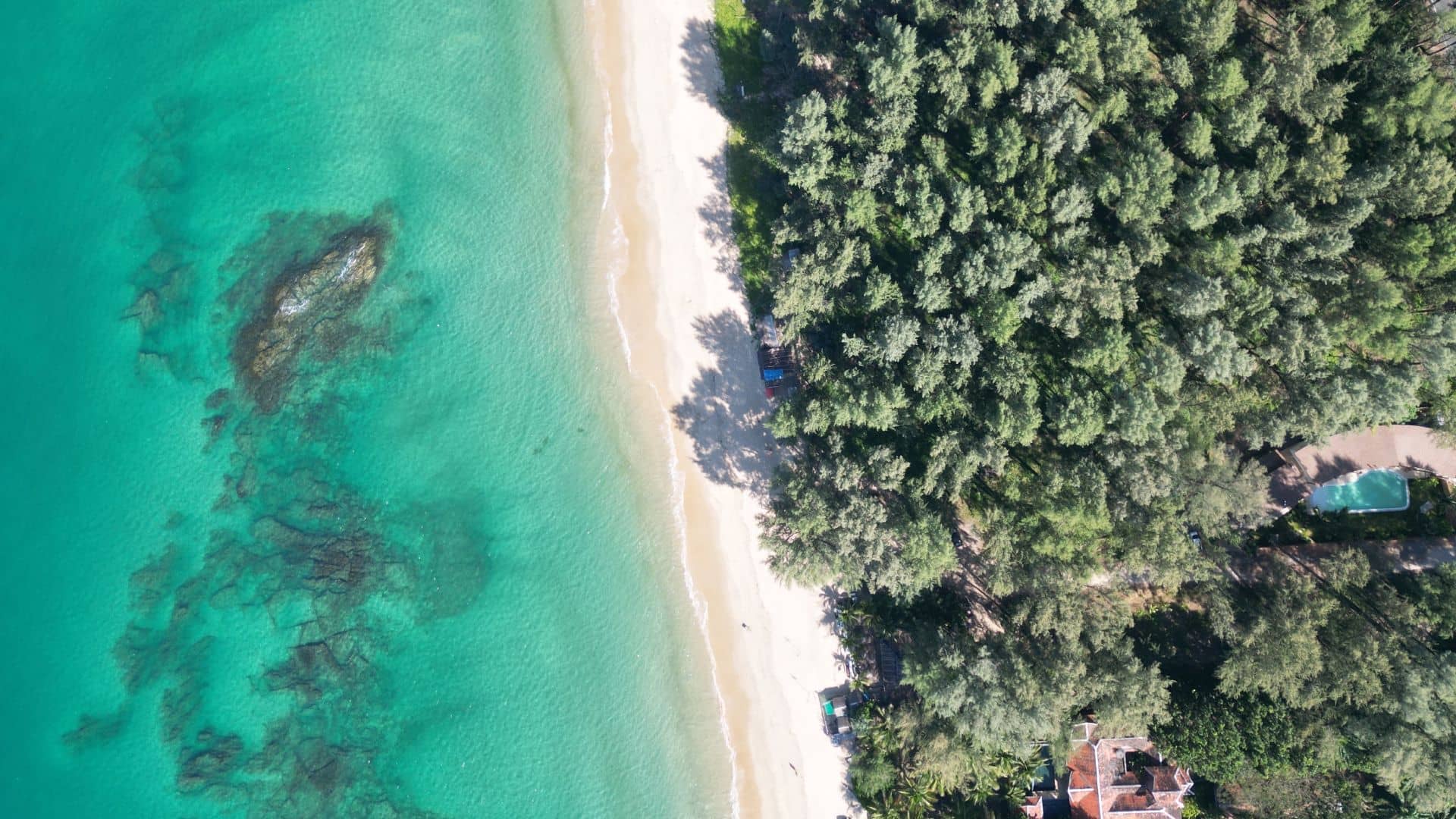 Quiet and uncrowded coastline at Natai Beach Phang Nga